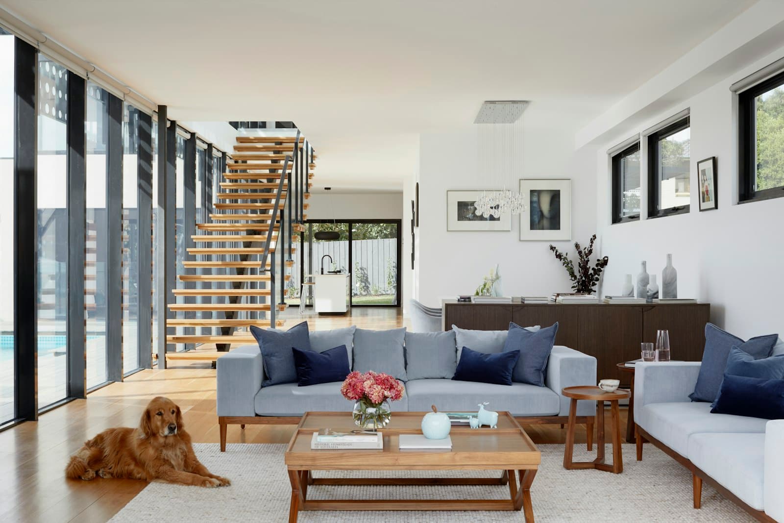 Double-height living room with open staircase