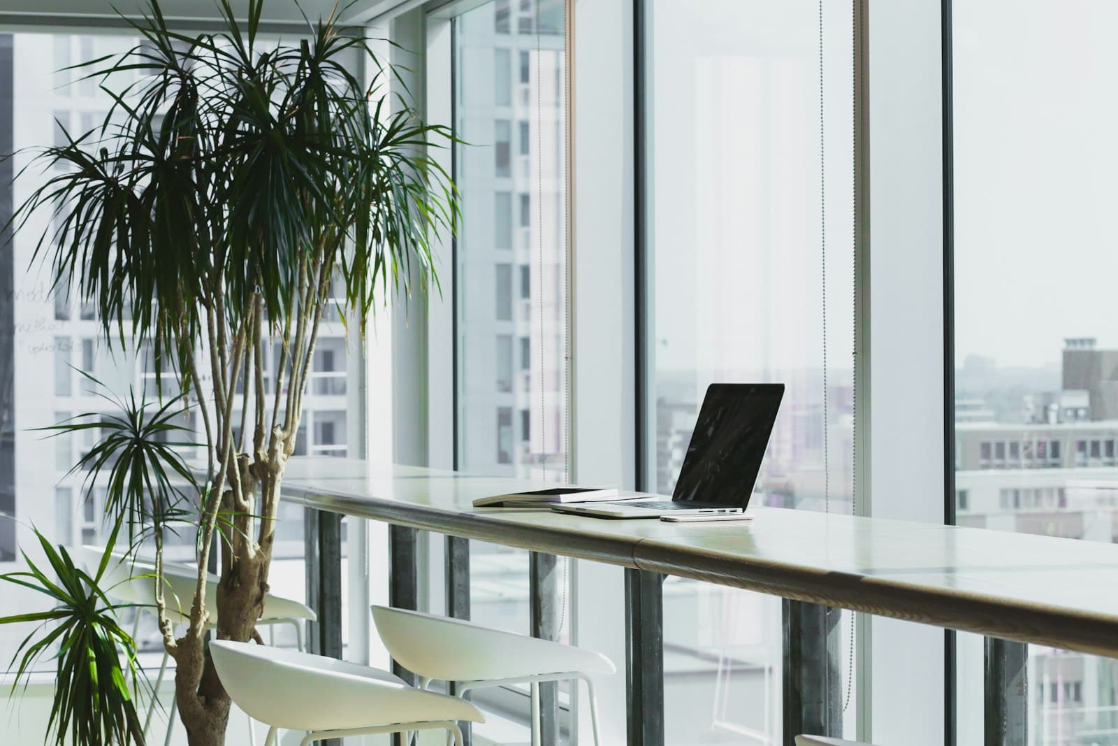 Desk area beside floor-to-ceiling windows