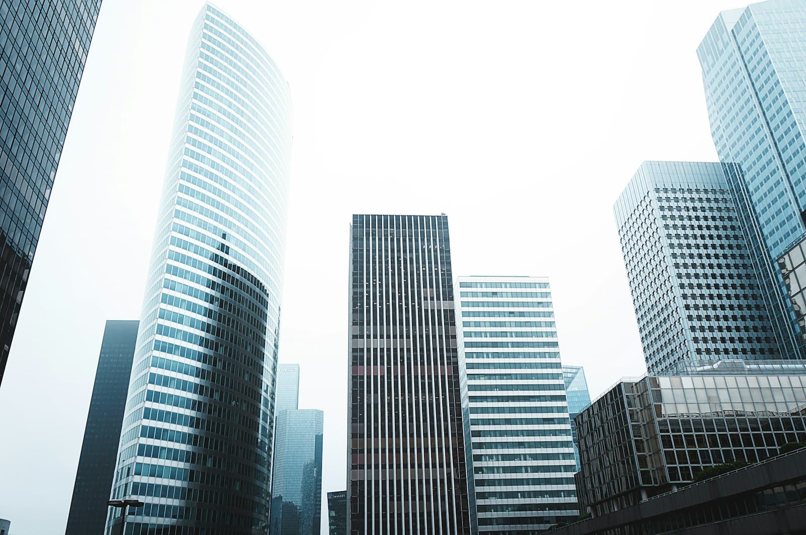 Commercial towers against a bright sky